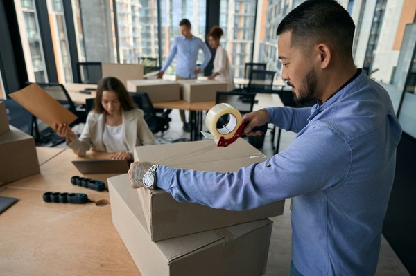 What are the essential tips for relocating a high-tech home office setup within the UK?